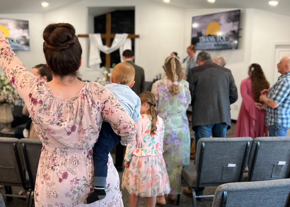 Numerous people worshipping during service at The Pentecostals of Cody